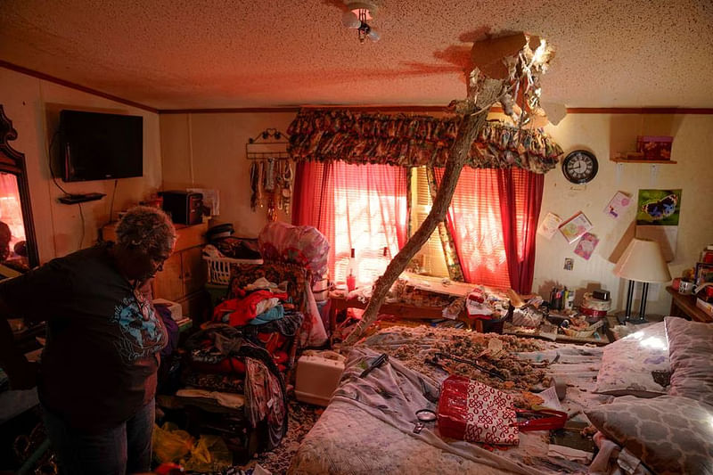 A tree branch is seen impaled through the ceiling during the storm.