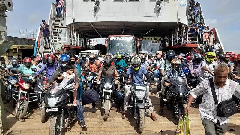 Motorcycles and buses on a ferry