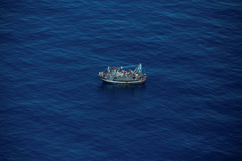 A boat in distress with about 400 people on board is pictured in Central Mediterranean Sea in this handout obtained by Reuters on 10 April, 2023.