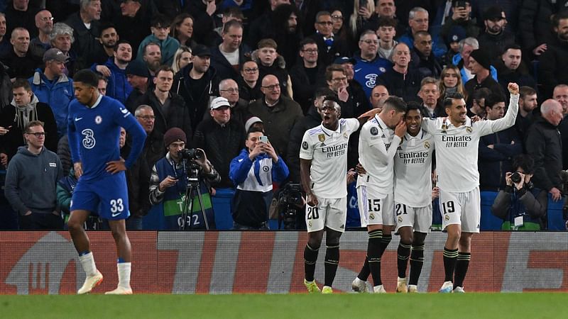 Real Madrid's Brazilian striker Rodrygo Goes (2R) celebrates scoring the team's second goal during the Champions League quarter-final second-leg football match between Chelsea and Real Madrid at Stamford Bridge in London on 18 April, 2023