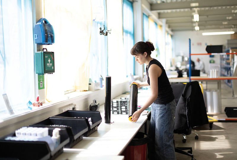 Lilly Ellis, Production Executive works on skincare products at 5 Squirrels, a skincare company, in Hove, Britain on 28 April, 2023.