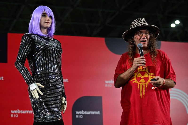 ingularityNET Founder and CEO Ben Goertzel performs along with the AI robot Desdemona during the Web Summit Rio 2023 at the RioCentro Expo Center in Rio de Janeiro, Brazil, on 3 May, 2023.