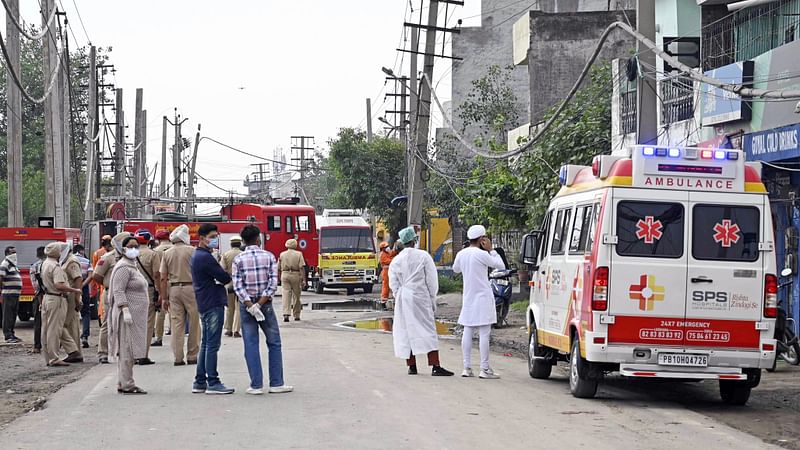 Punjab police personnel and health workers during a rescue operation after a gas leak incident occur at a factory in Giaspura area of Ludhiana, Punjab on 30 April. At least 11 people died in the incident and several being hospitalised