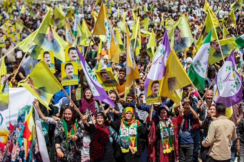 Thousands of Syrian Kurds protest in Qamishli in northeastern Syria on May 10, 2023 against Turkish President Recep Tayyip Erdogan in a show of support for the opposition in Turkey's upcoming elections later this week