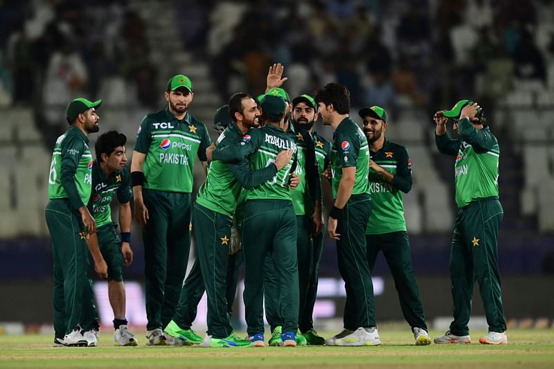 Pakistan's cricketers celebrate after the dismissal of New Zealand's Henry Nicholls (not pictured) during the third one-day international (ODI) cricket match between Pakistan and New Zealand at the National Stadium in Karachi on 3 May, 2023