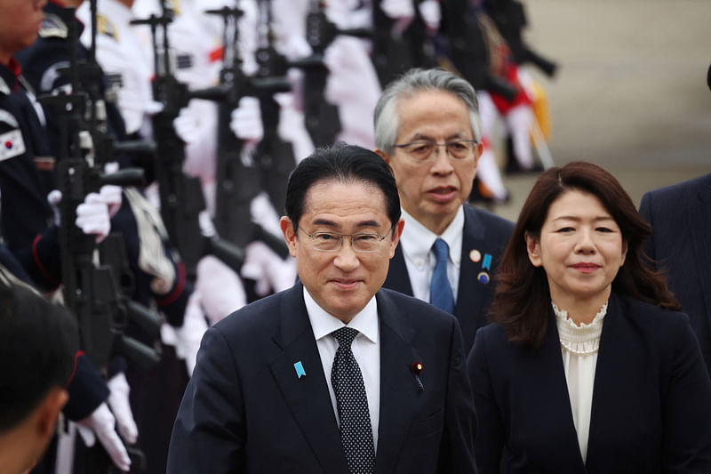 Japanese Prime Minister Fumio Kishida and his wife Yuko Kishida inspect an honor guard upon their arrival to Seoul airbase in Seongnam, South Korea, May 7, 2023