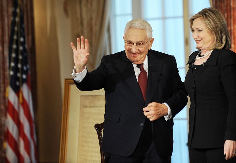 US Secretary of State Hillary Clinton (R) and former US Secretary of State Henry Kissinger prepare to leave after participating in “Conversations on Diplomacy, Moderated by Charlie Rose,” at the Department of State in Washington, DC, on 20 April, 2011