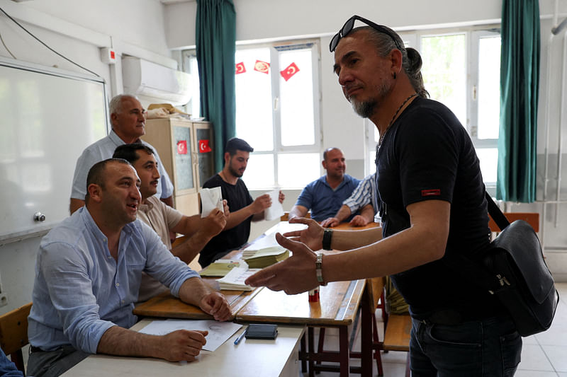 Mehmet Ali Fakioglu arrives to cast a vote at a school that is used as a polling station, during Turkish presidential and parliamentary elections, in Hatay province, Turkey on 14 May, 2023