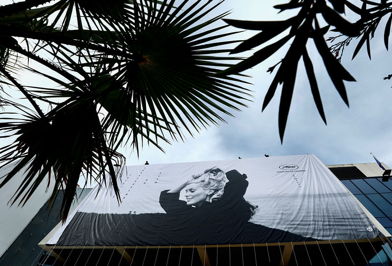 The 76th Cannes Film Festival - The official poster - Cannes, France, 14 May, 2023. A general view shows the official poster featuring Catherine Deneuve in the film La Chamade, on the facade of the festival palace ahead of the opening ceremony.