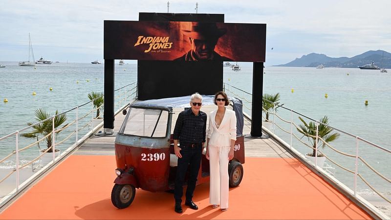 US actor Harrison Ford (L) and British actress Phoebe Waller Bridge pose during a photocall for the film "Indiana Jones and the Dial of Destiny" during the 76th edition of the Cannes Film Festival in Cannes, southern France, on 18 May, 2023.