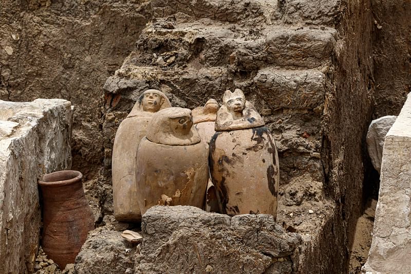 Clay pots and ritual vessels are placed near stony beds used for mummification, in the Saqqara necropolis south of Cairo, where archaeologists unearthed two human and animal embalming workshops, as well as two tombs, on 27 May, 2023