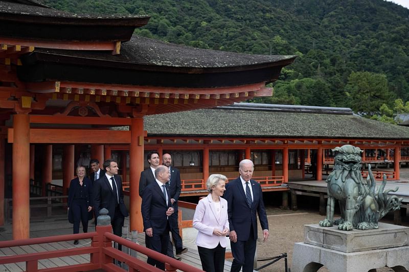 Italy's Prime Minister Giorgia Meloni, Britain's Prime Minister Rishi Sunak, France's President Emmanuel Macron, Canada's Prime Minister Justin Trudeau, Germany's Chancellor Olaf Scholz, President of the European Council Charles Michel, European Commission President Ursula von der Leyen and US President Joe Biden visit the Itsukushima Shrine in Miyajima Island as part of the G7 Leaders' Summit, on 19 May, 2023.