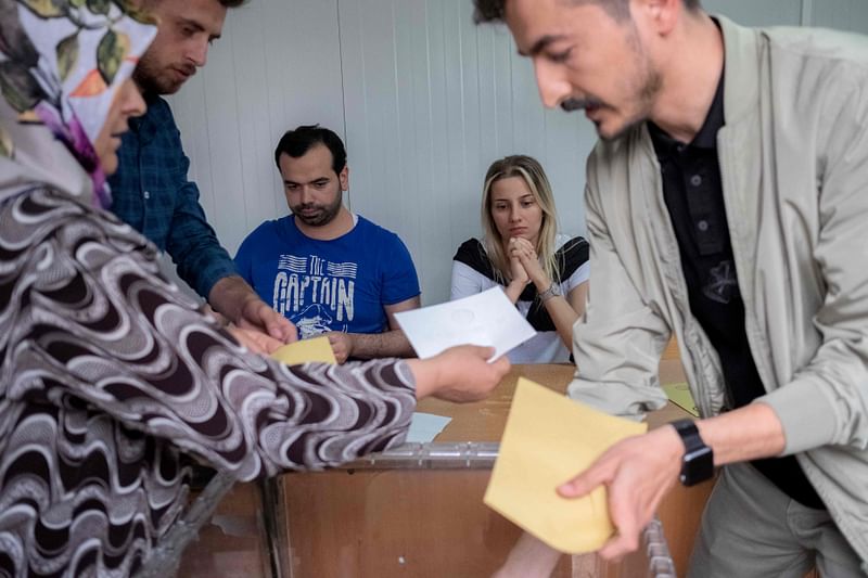 Electoral officials count the ballots on the day of the second round of the presidential election in the earthquake-hit city of Kahramanmaras on May 28, 2023.