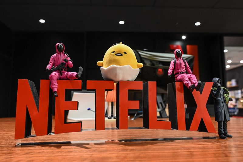 This photo taken on 24 March, 2023 shows a Netflix display at the main entrance to the office of streaming giant Netflix during a media tour and press conference in the Roppongi area of Tokyo.