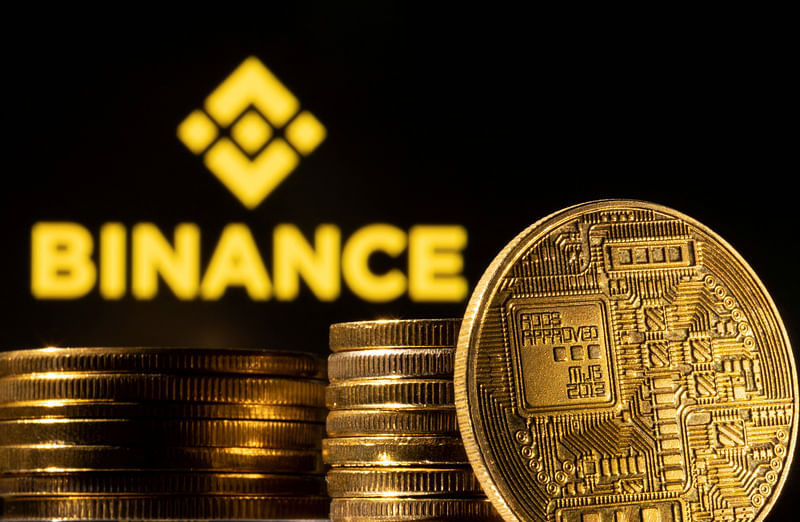 A representation of the cryptocurrency is seen in front of Binance logo in this illustration taken, March 4, 2022