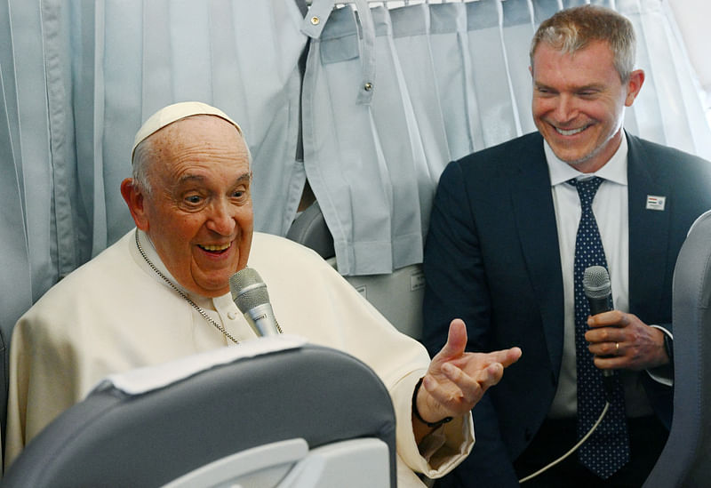 Pope Francis holds a news conference as he returns to the Vatican following his apostolic journey to Hungary, aboard the plane, on 30 April, 2023