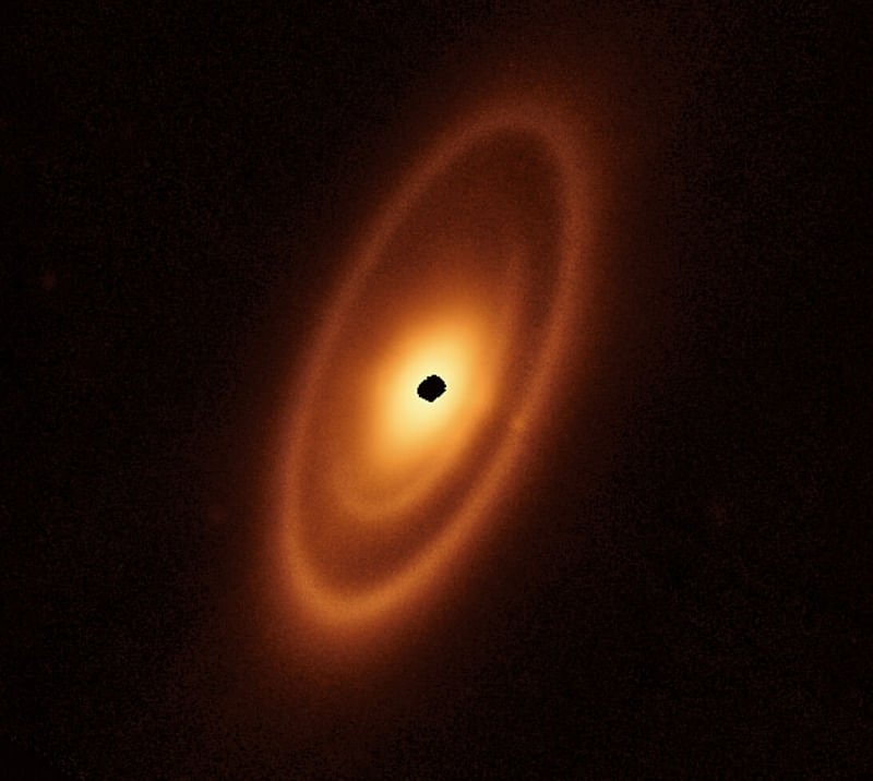 This handout image from the James Webb Space Telescope released by NASA/ESA/CSA on 9 May, 2023, shows for the first time the inner asteroid belts that encircle the nearby star Fomalhaut. The dusty debris disc surrounding the young star Fomalhaut is from Webb’s Mid-Infrared Instrument (MIRI). It reveals three nested belts extending out to 23 billion kilometres from the star. The inner belts — which had never been seen before — were revealed by Webb for the first time.