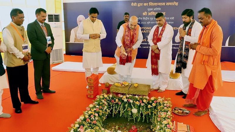 Union Home Minister Amit Shah lays the foundation stone of the Maitri Dwar, the 2nd Cargo Gate of the Land Port Authority of India, in North 24 Parganas on 9 May, 2023. Union Minister of State for Home Affairs Nisith Pramanik and Leader of the Opposition in West Bengal Assembly Suvendu Adhikari are also seen