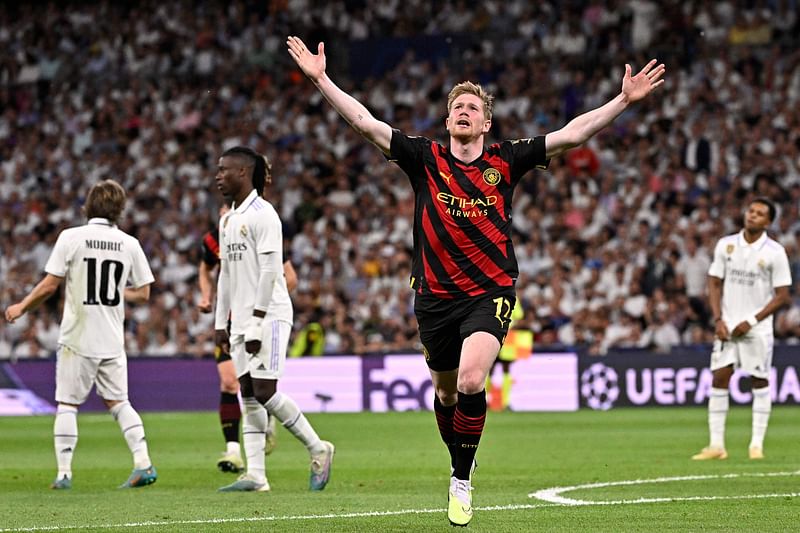 Manchester City's Belgian midfielder Kevin De Bruyne celebrates scoring his team's first goal during the UEFA Champions League semi-final first leg match between Real Madrid CF and Manchester City at the Santiago Bernabeu stadium in Madrid on 9 May 2023