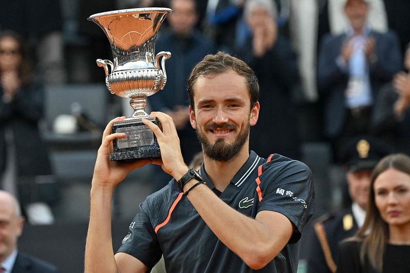 Russia's Daniil Medvedev poses with the trophy celebrating winning the final of the Men's ATP Rome Open against Denmark's Holger Rune on the central court of Foro Italico in Rome on 21 May 2023