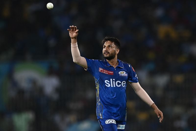 Mumbai Indians' Akash Madhwal prepares to catch a ball during the Indian Premier League eliminator between Lucknow Super Giants and Mumbai Indians at the MA Chidambaram Stadium in Chennai on 24 May 2023