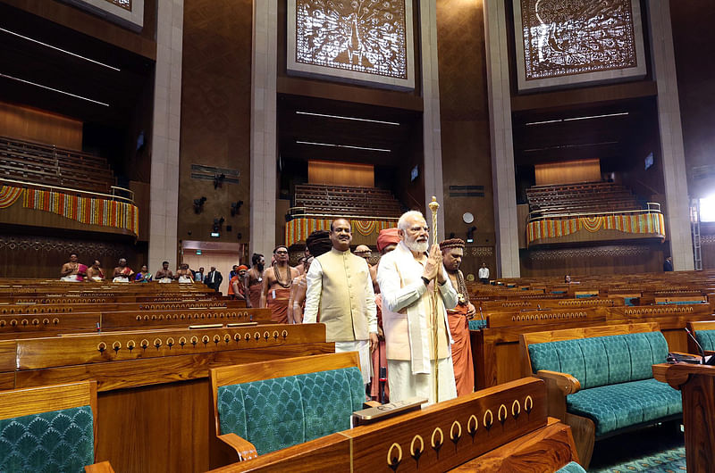 Indian prime minister Narendra Modi carries the historic 'Sengol' into the Lok Sabha chamber of the new Parliament building, in New Delhi on 28 May 2023