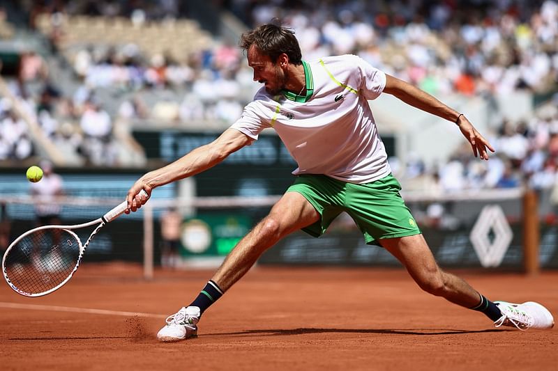 Russia's Daniil Medvedev plays a backhand return to Brazil's Thiago Seyboth Wild during their men's singles match on day three of the Roland-Garros Open tennis tournament at the Court Philippe-Chatrier in Paris on 30 May, 2023