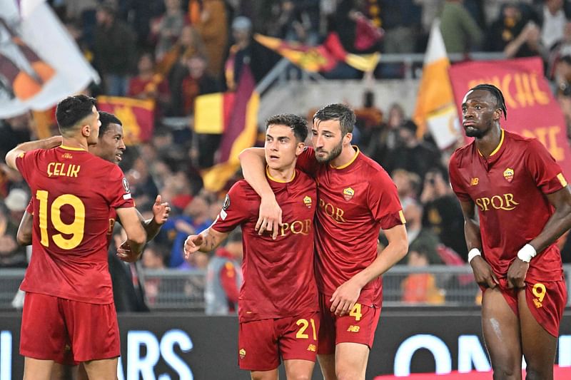 AS Roma's Argentinian forward Paulo Dybala and AS Roma's Italian midfielder Bryan Cristante celebrates with teammates after winning the UEFA Europa League semi-final first leg between AS Roma and Bayer Leverkusen at the Olympic Stadium in Rome on 11 May 2023