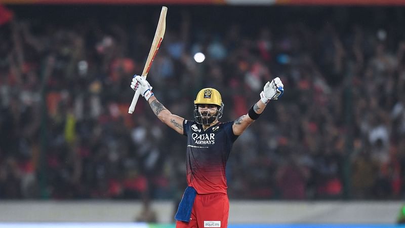 Royal Challengers Bangalore's Virat Kohli celebrates after scoring a century during the Indian Premier League match between Sunrisers Hyderabad and Royal Challengers Bangalore at the Rajiv Gandhi International Stadium in Hyderabad on 18 May 2023