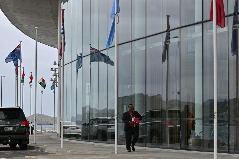 A man walks outside APEC Haus, venue of the Forum for India–Pacific Islands Cooperation in Port Moresby, Papua New Guinea on 22 May, 2023