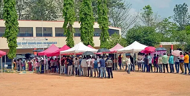 People wait in line to cast their votes in Bengaluru of Karnataka last Wednesday, 10 May 2023.