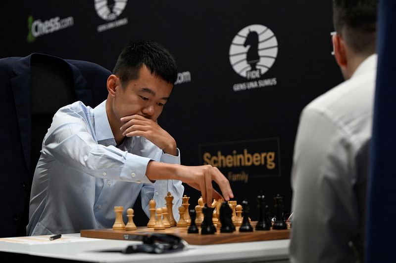 Chinese chess grandmaster Ding Liren moves a piece during the first day of the chess Candidates Tournament FIDE 2022, in Madrid on 17 June, 2022