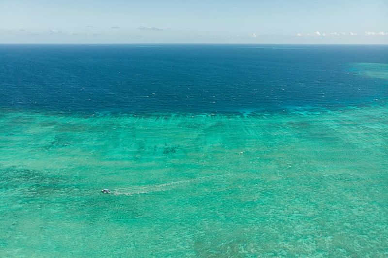 This photograph taken on April 30, 2023 shows an aerial view of a section of the lagoon off the island of Mayotte. A Marine Natural Park was created in 2010 to help preserve the lagoon and protect its ecosystem from different threats including overfishing and coral bleaching.