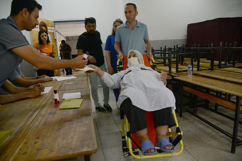 A voter arrives to cast their ballot during the presidential runoff vote in Diyarbakir, on 28 May , 2023. Turkey votes in a historic runoff that Turkish president enters as the firm favourite to extend two decades of his Islamic-rooted rule to 2028