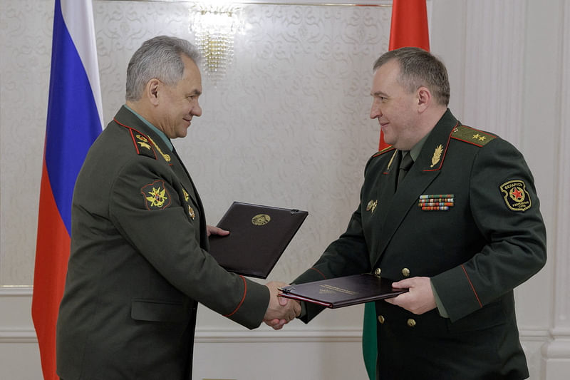 Russian Defence Minister Sergei Shoigu shakes hands with Belarusian Defence Minister Victor Khrenin during a meeting in Minsk, Belarus on 25 May, 2023