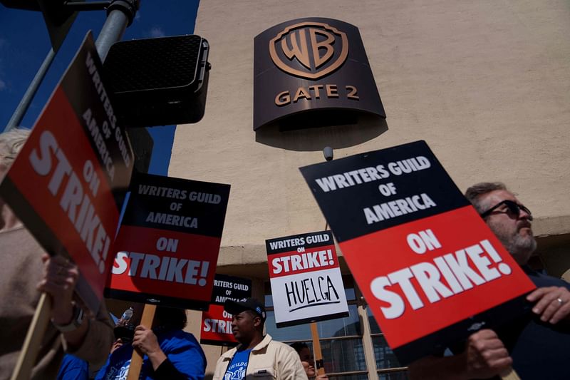 Striking Writers Guild of America workers picket outside the Warner Brother studios, on May 2, 2023 in Burbank, California