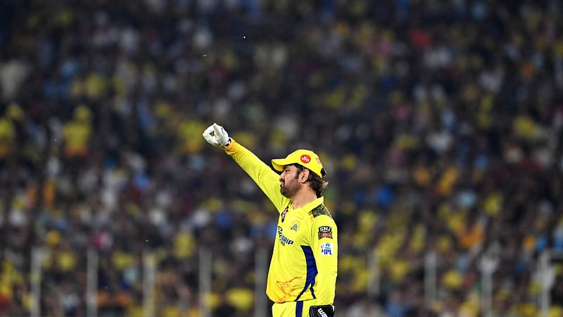 Chennai Super Kings' captain Mahendra Singh Dhoni adjusts the field during the Indian Premier League (IPL) Twenty20 final cricket match between Gujarat Titans and Chennai Super Kings at the Narendra Modi Stadium in Ahmedabad on 29 May, 2023