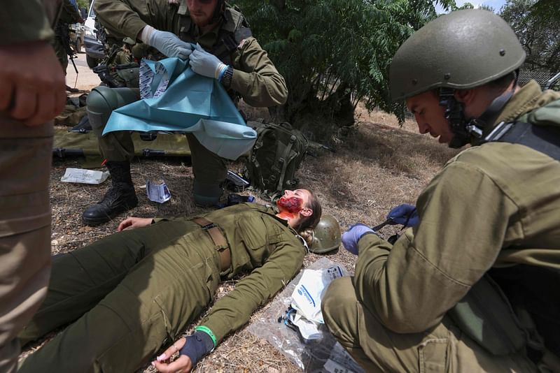 Israeli soldiers take part in the annual general military exercise 'Firm Hand' in the northern Kibbutz of Yiftah near the border with Lebanon on May 30, 2023