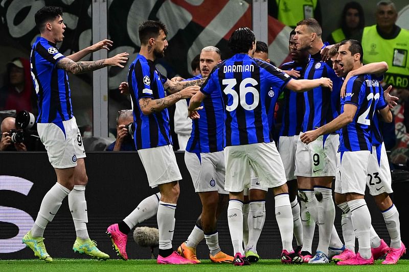 Inter Milan's Bosnian forward Edin Dzeko (3rd R) celebrates with teammates after opening the scoring during the UEFA Champions League semi-final first leg football match between AC Milan and Inter Milan, on 10 May, 2023