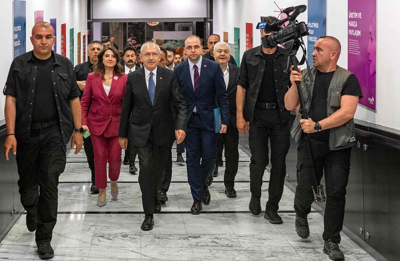 Kemal Kilicdaroglu (C) the 74-year-old leader of the center-left, pro-secular Republican People's Party, or CHP, leaves after a press conference in Ankara on 15 May, 2023