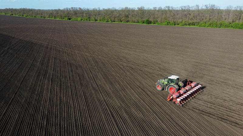 An aerial view shows a tractor sowing corn seeds in a field near the village of Chaltyr in the Rostov region, Russia, on 5 May, 2023