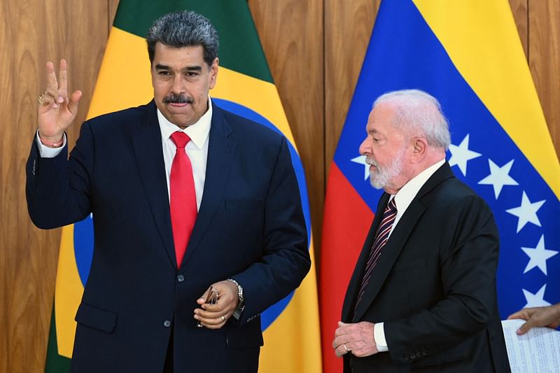 Venezuela's President Nicolas Maduro (L) and Brazil's President Luiz Inacio Lula da Silva (R) gesture after a joint press conference at the Planalto Palace in Brasilia on May 29, 2023