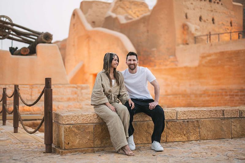 This handout picture provided by the Saudi Tourism Authority on May 1, 2023, shows Argentina's forward Lionel Messi, his wife Antonela Roccuzzo visiting Diriyah near Riyadh