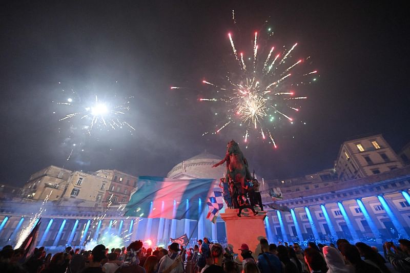 Fans of SSC Napoli celebrate with fireworks on Piazza del Plebiscito on 4 May 2023 in downtown Naples after Napoli won the Italian champions "Scudetto" title following a decisive match in Udine