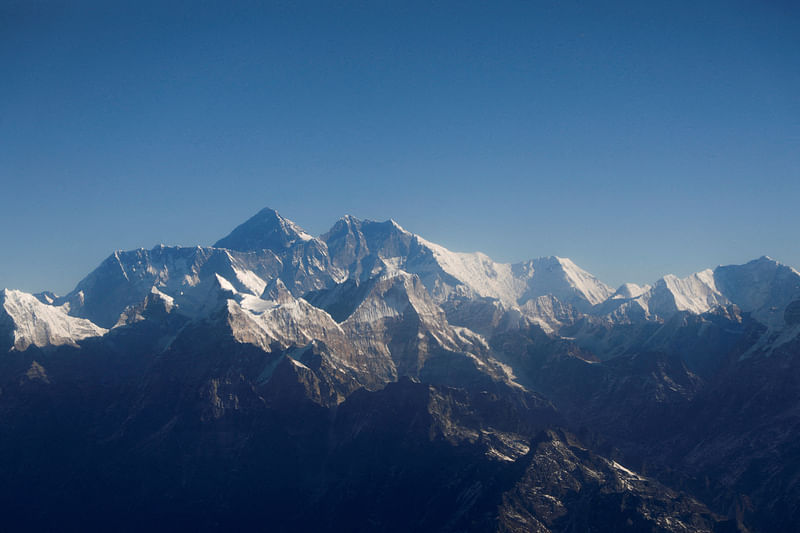 Mount Everest, the world highest peak, and other peaks of the Himalayan range are seen through an aircraft window during a mountain flight from Kathmandu, Nepal 15 January, 2020.