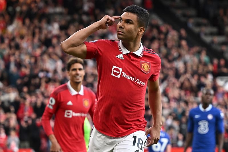 Manchester United's Brazilian midfielder Casemiro celebrates after scoring their opening goal during the English Premier League match between Manchester United and Chelsea at Old Trafford in Manchester, England on 25 May 2023