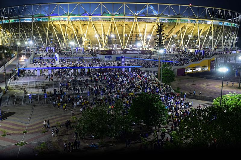 Cricket fans leave the Narendra Modi Stadium after the end of the Indian Premier League (IPL) Twenty20 second qualifier cricket match between the Gujarat Titans and the Mumbai Indians in Ahmedabad on 27 May, 2023