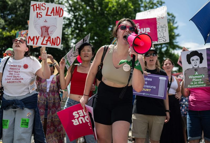 Abortion rights demonstrators rally to mark the first anniversary of the US Supreme Court ruling in the Dobbs v Women's Health Organization case in Washington, DC on June 24, 2023