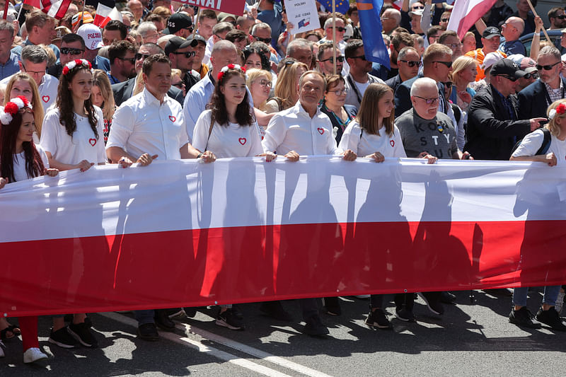 Mayor of Warsaw Rafal Trzaskowski, leader of main opposition party Civic Platform (PO) Donald Tusk and former Polish President and Peace Nobel Prize laureate Lech Walesa take part in the march on the 34th anniversary of the first democratic elections in postwar Poland, in Warsaw, Poland, on 4 June, 2023