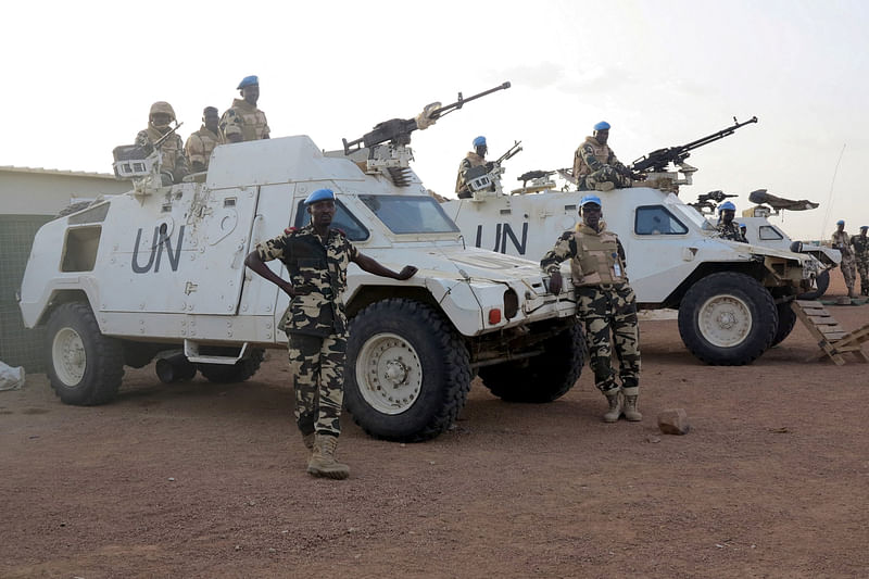 Chadian peacekeepers stand guard at the Minusma peacekeeping base in Kidal, Mali, 22 July 2015.